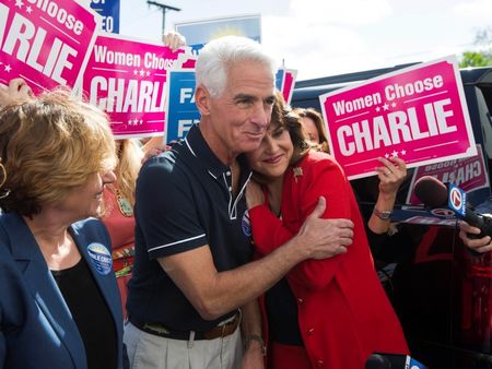 © Reuters. Former Florida Governor and Democratic gubernatorial candidate Charlie Crist hugs his running mate Annette Taddeo during the first stop of his state-wide bus tour in Miami