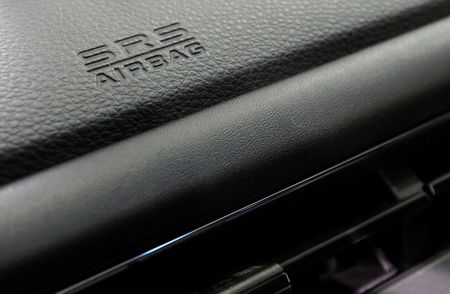 © Reuters. An airbag logo is seen on a dashboard of a Honda Motor Co's car displayed at the company's showroom in Tokyo