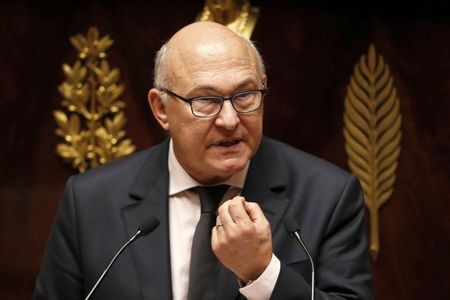 © Reuters. French Finance Minister Sapin speaks at the start of debate on France's 2015 budget at the National Assembly in Paris