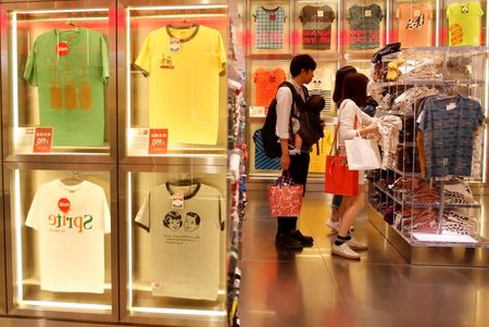 © Reuters. File photo of shoppers looking at T-shirts in a clothing retail store at Ginza shopping district in Tokyo