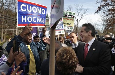 © Reuters. Democratic New York Governor Andrew Cuomo and greets supporters after casting his votes in Mount Kisco