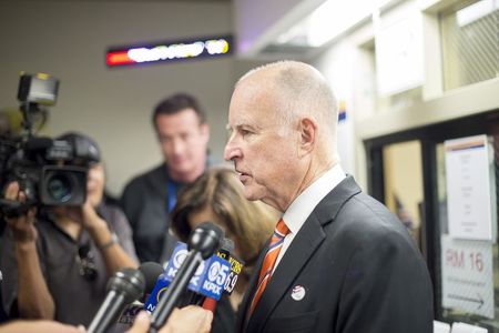 © Reuters. California Governor Brown speaks with reporters after casting his ballot at the Alameda County Registrar of Voters office in Oakland