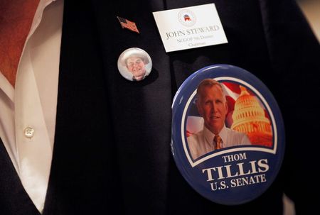 © Reuters. John Steward, NCGOP 9th district chairman, wears a Thom Tillis pin while attending the Thom Tillis U.S. midterm elections party in Charlotte