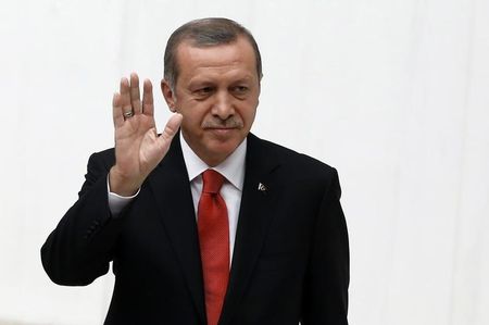 © Reuters. Turkey's President Tayyip Erdogan waves as he attends a debate marking the reconvene of the parliament after a summer recess at the Turkish Parliament in Ankara