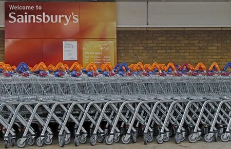 © Reuters. Shopping trolleys are lined up in front of a Sainsury's supermarket  in London