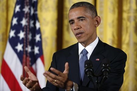 © Reuters. U.S. President Obama answers questions during news conference in the East Room of the White House in Washington