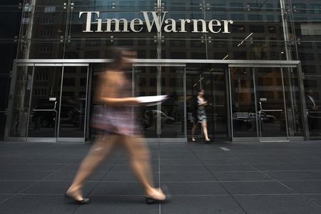 © Reuters. File photo of a woman walking past the Time Warner Center near Columbus Circle in Manhattan, New York