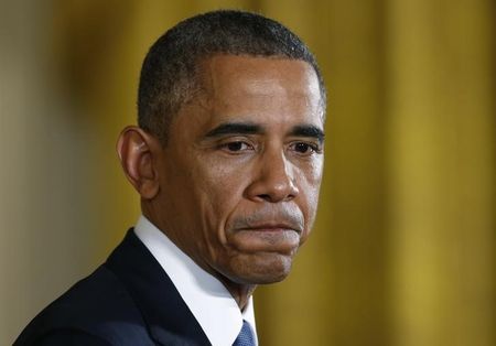 © Reuters. U.S. President Obama pauses during news conference in the East Room of the White House in Washington