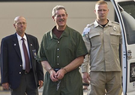 © Reuters. Convicted financier Allen Stanford arrives at Federal Court in Houston for sentencing.