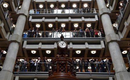 © Reuters. Employees look out over the main atrium of Lloyd's of London insurance market in the City of London