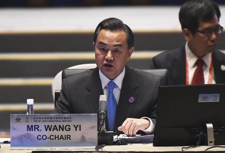 © Reuters. China's Foreign Minister Wang Yi speaks at the start of Asia-Pacific Economic Cooperation (APEC) Summit ministerial meetings at the China National Convention Centre (CNCC) in Beijing