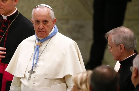 © Reuters. Pope Francis looks on during a special audience with members of Italian adult scouts in Paul VI hall at the Vatican