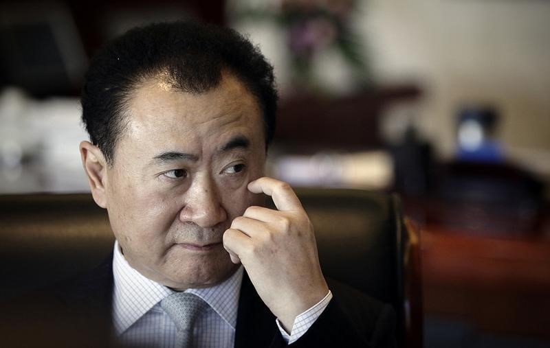 © Reuters. LE LEADER DE L'IMMOBILIER EN CHINE RÉDUIT SES PRÉTENTIONS EN BOURSE