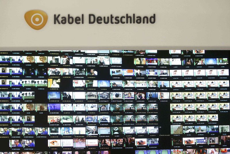 © Reuters. File photo of logo of Kabel Deutschland above a monitor wall at the Kabel Deutschland playout center in Frankfurt