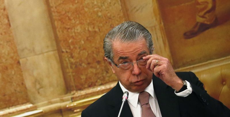© Reuters. Salgado, former CEO of BES, adjusts his glasses during a parliament committee to speak on BES' situation at the Portuguese parliament in Lisbon
