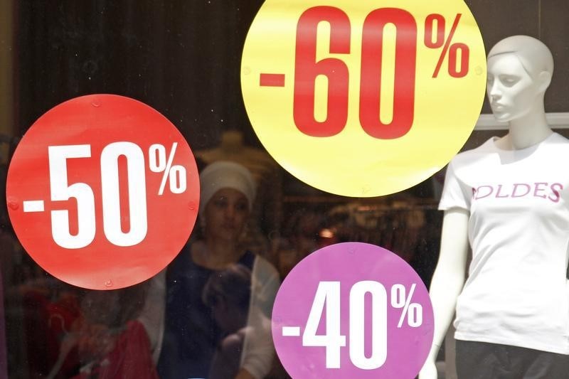 © Reuters. Discount signs are displayed in a clothing store window in Strasbourg