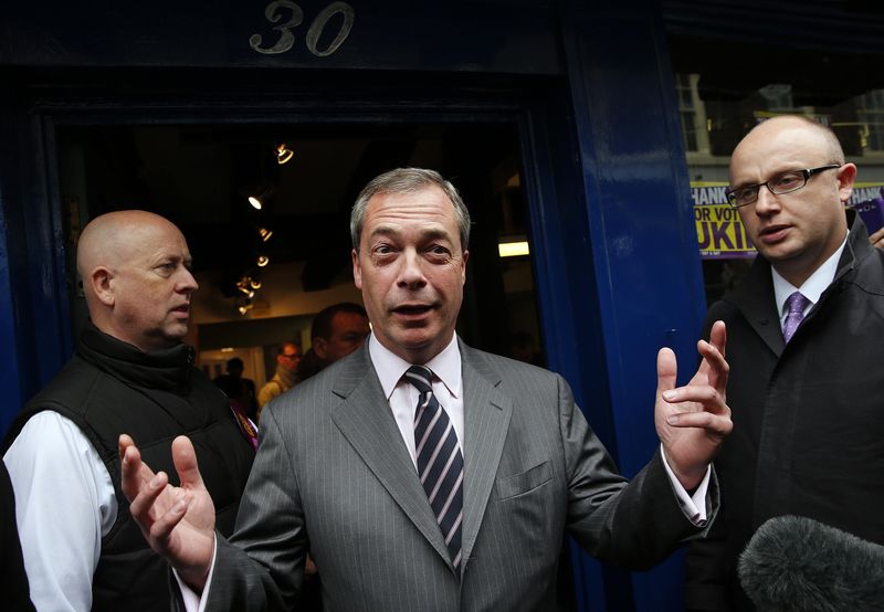 © Reuters. Nigel Farage, leader of the United Kingdom Independence Party (UKIP), reacts as he leaves UKIP party local headquarters in Rochester, southeast England