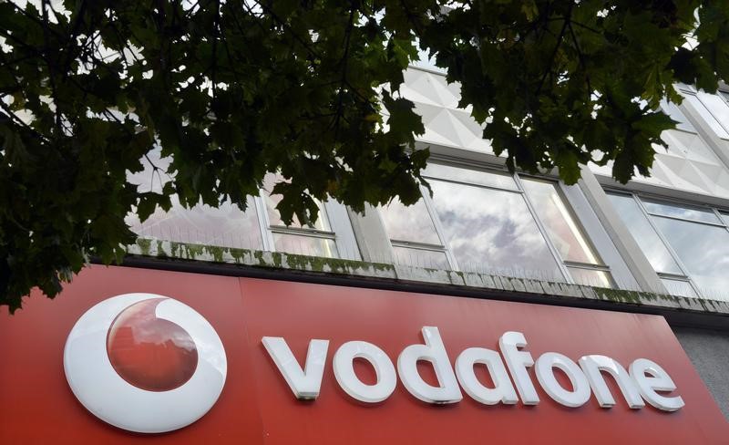 © Reuters. Vodafone branding is seen outside a retail store in London