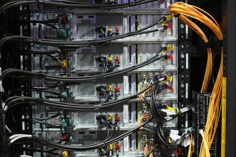 © Reuters. General view of fibre optics and cabling from behind a storage rack at the IBM booth at the CeBIT trade fair in Hanover 