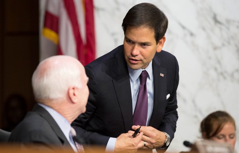 © Reuters. Senator Rubio speaks with Senator McCain as U.S. Secretary of State Kerry testifies during a Senate Foreign Relations Committee hearing on "U.S. Strategy to Defeat the Islamic State in Iraq and the Levant" on Capitol Hill