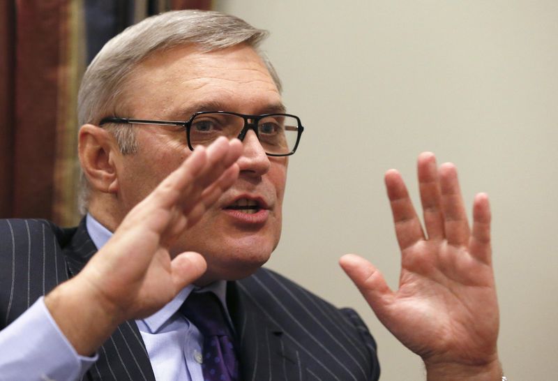 © Reuters. Russia's former Prime Minister and opposition leader Kasyanov speaks during an interview with Reuters at his office in Moscow