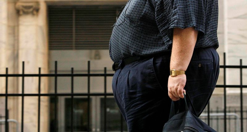 © Reuters. L'OBÉSITÉ PEUT PARFOIS ÊTRE UN "HANDICAP" DANS LE TRAVAIL