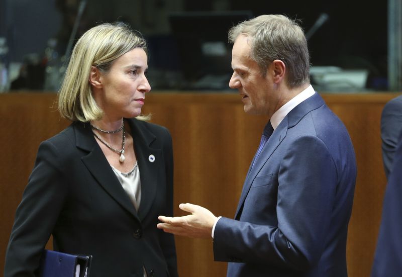 © Reuters. EU foreign policy chief Mogherini listens to EU Council President Tusk during a EU leaders summit in Brussels