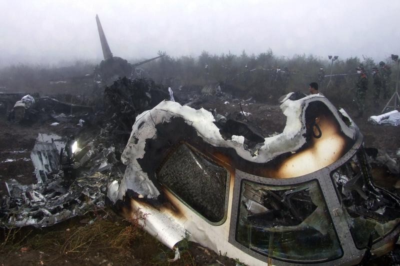 © Reuters. The wreckage of a crashed passenger plane is seen in Yichun