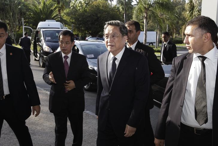 © Reuters. China's Yu, chairman of the CPPCC, is escorted by staff members as he arrives at the Foreign Ministry in Rabat