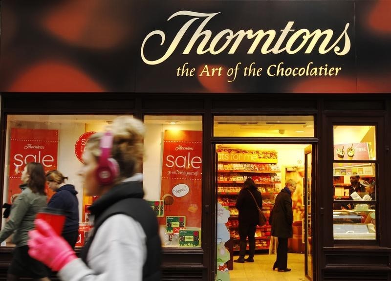 © Reuters. Customers shop inside Thorntons chocolate shop on Oxford Street in London
