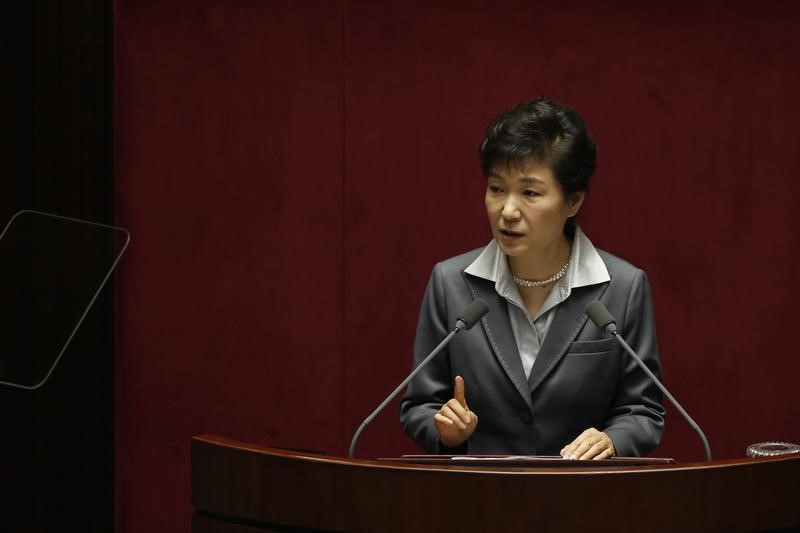 © Reuters. South Korean President Park Geun-hye delivers her speech on 2015's budget bill during a plenary session at the National Assembly in Seoul