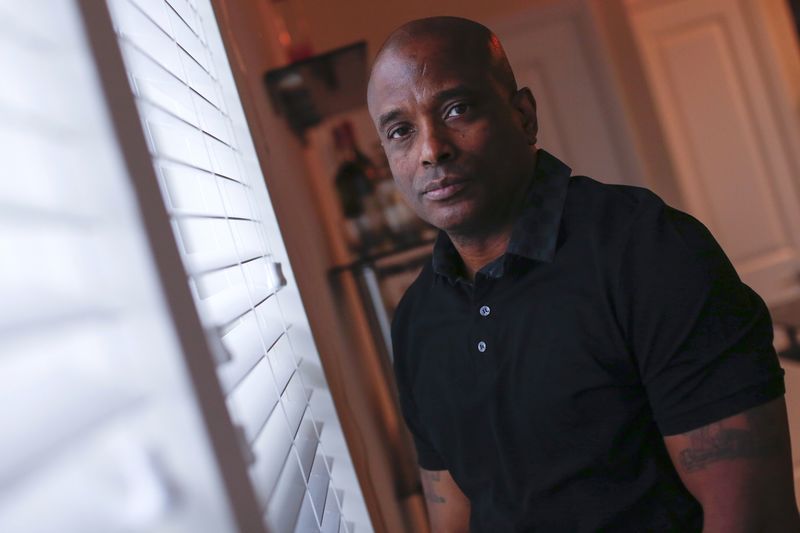 © Reuters. Retired NYPD detective Harold Thomas poses in West Hempstead, New York