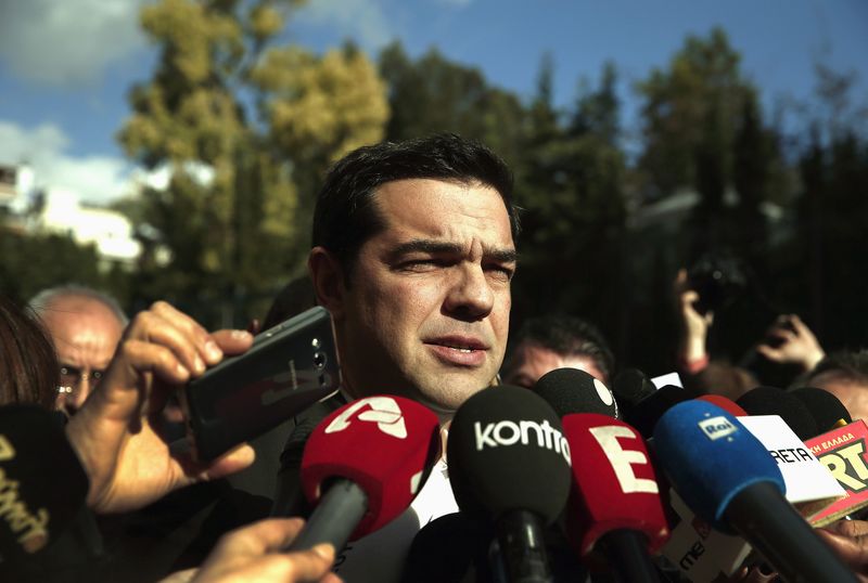 © Reuters. Tsipras, opposition leader and head of radical leftist Syriza party, talks to reporters outside the parliament building after the last round of a presidential vote in Athens