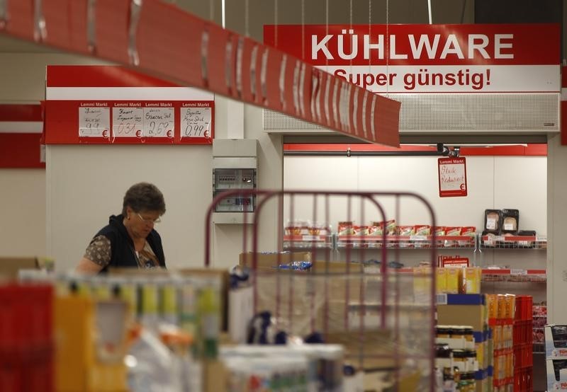 © Reuters. A woman looks at goods in a supermarket in the western city of Herne