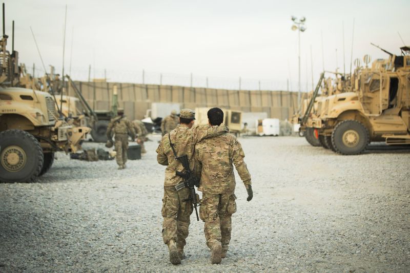© Reuters. File photo of a U.S. soldier from the 3rd Cavalry Regiment walking with the unit's Afghan interpreter before a mission near forward operating base Gamberi in the Laghman province of Afghanistan