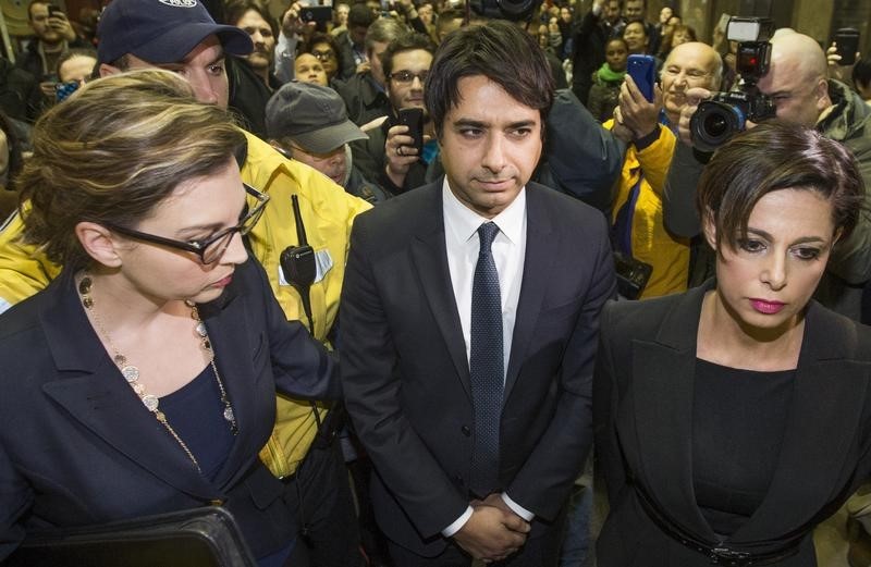 © Reuters. Celebrity radio host Ghomeshi leaves court after getting bail on multiple counts of sexual assault in Toronto