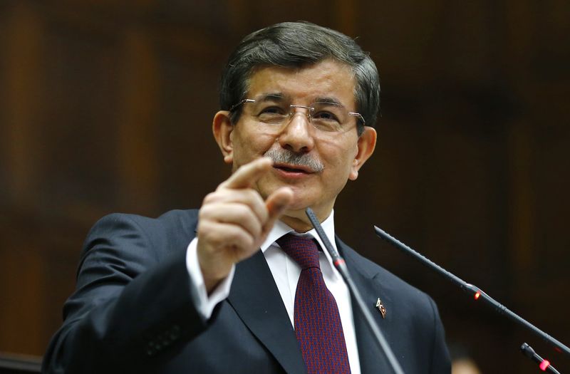 © Reuters. Turkey's PM Davutoglu addresses members of parliament from ruling AK Party during meeting at the Turkish parliament in Ankara