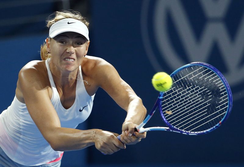 © Reuters. Maria Sharapova of Russia plays a backhand return to Yaroslava Shvedova of Kazakhstan during their women's singles second round match at the Brisbane International tennis tournament in Brisbane