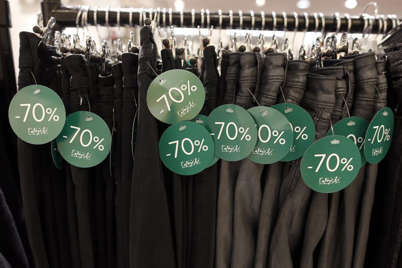 © Reuters. Trousers with discount sale tags on display at a department store in Paris, on the eve of the start of winter sales in France