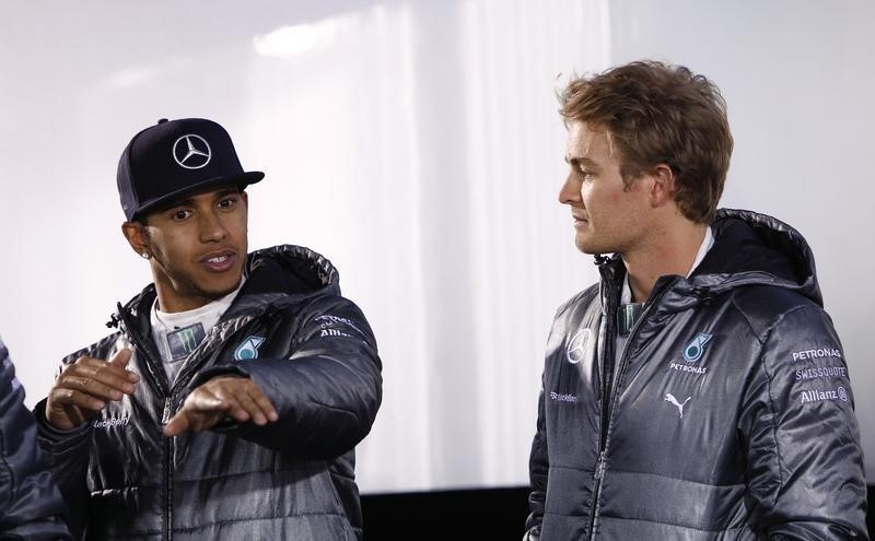 © Reuters. Mercedes Formula One World Champion Hamilton speaks to Formula One driver Rosberg during 'Stars & Cars' event in Stuttgart