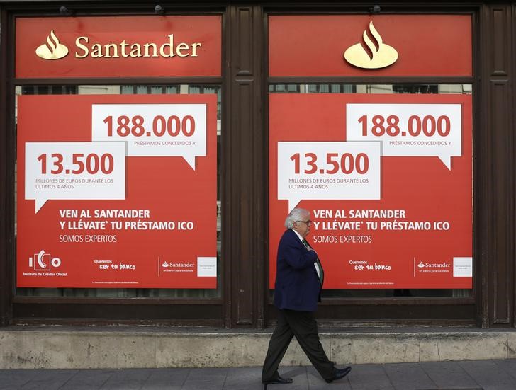 © Reuters. A man walks past a Santander bank branch in Madrid