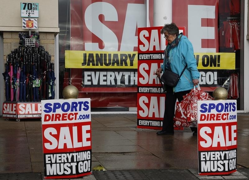 © Reuters. A pedestrian walks past a branch of Sports Direct in Liverpool northern England