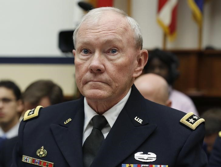 © Reuters. Chairman of the Joint Chiefs Dempsey listens to a question during the House Armed Services Committee on Capitol Hill in Washington