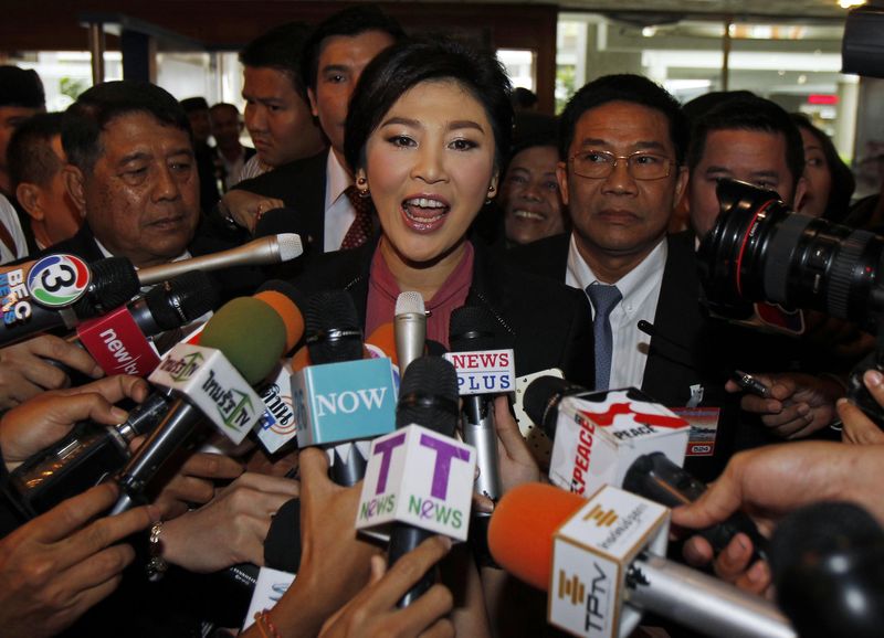 © Reuters. Ousted former PM Yingluck arrives at Parliament before the National Legislative Assembly meeting in Bangkok