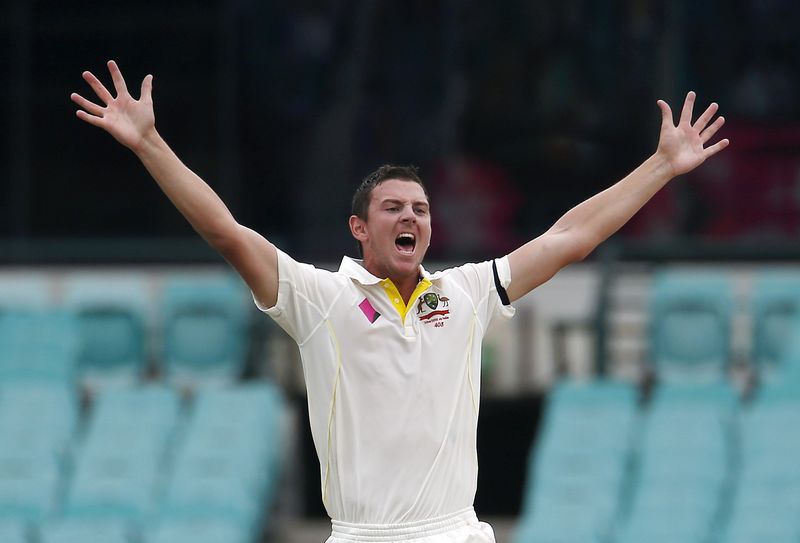 © Reuters. Australia's Hazlewood appeals successfully for LBW to dismiss India's Ravichandran Ashwin for one run during the fifth day's play in the fourth test at the SCG