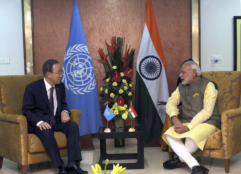 © Reuters. Handout of UN Secretary-General Ban Ki-moon talks with India's Prime Minister Modi during their meeting in Gandhinagar