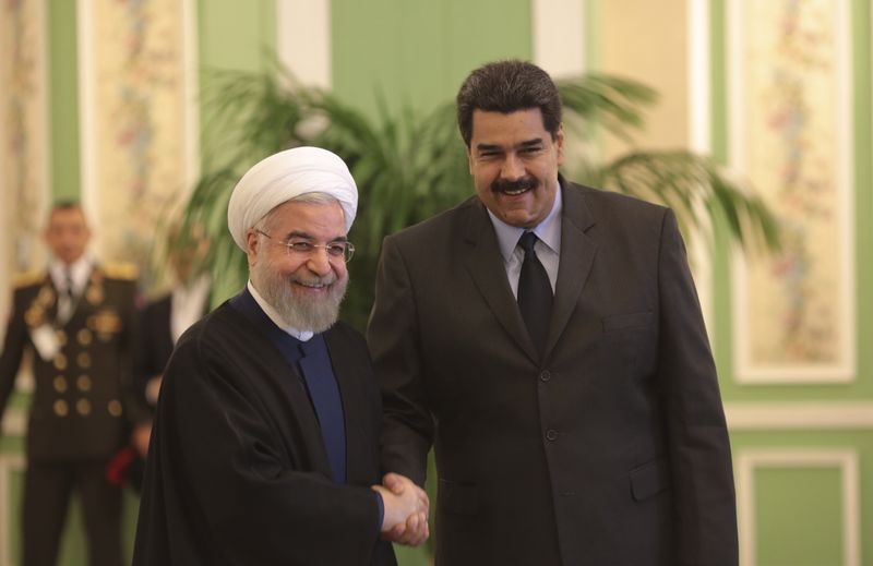 © Reuters. Venezuela's President Nicolas Maduro is welcomed by Iran's President Hassan Rouhani in Tehran