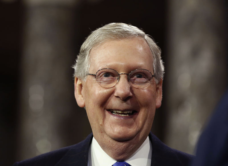 © Reuters. U.S. Senate Majority Leader Mitch McConnell smiles after he ceremonially swore-in, in the Old Senate Chamber on Capitol Hill in Washington