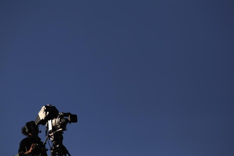 © Reuters. A camera operator films the Swiss Super League promotion and relegation soccer match against FC Sion in Aarau