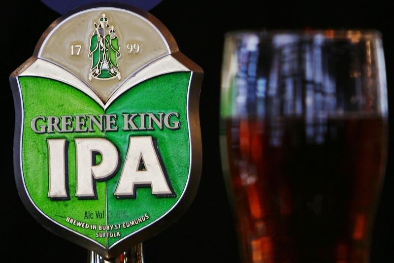 © Reuters. Greene King beer pump and pint of beer are seen in a pub in central London